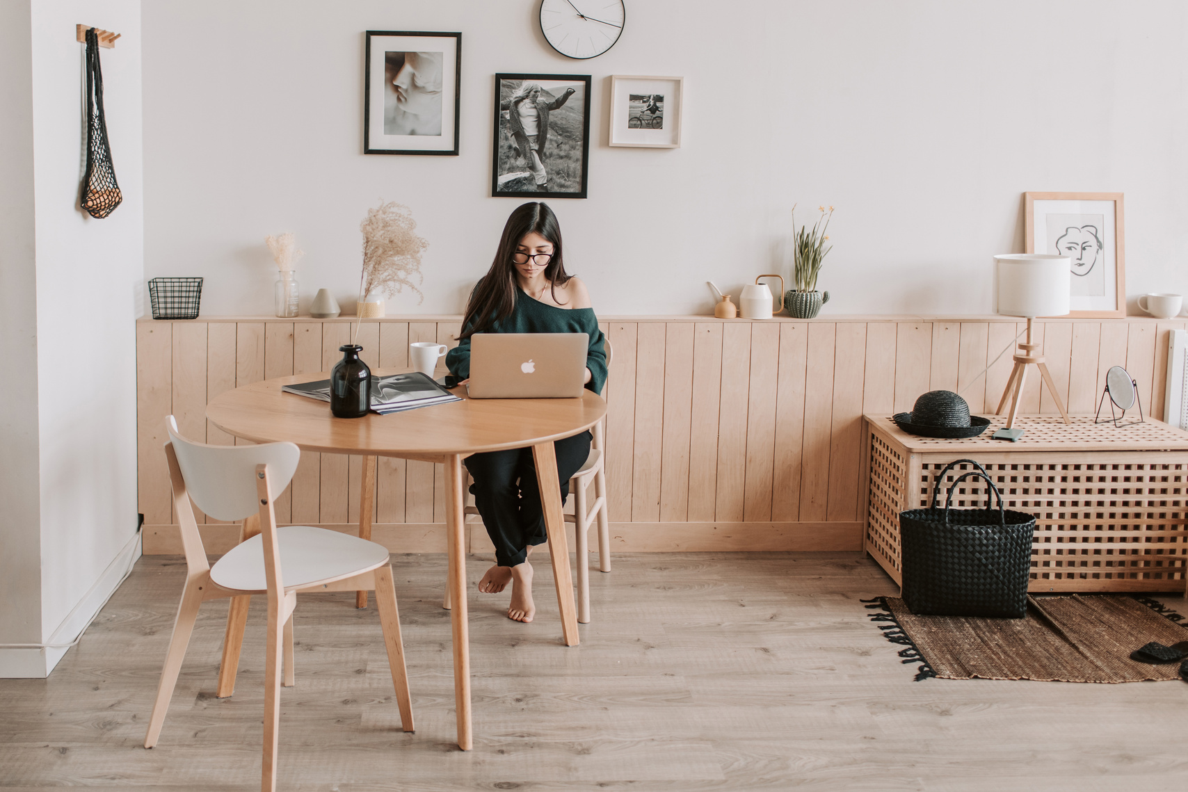 Pensive woman using laptop at home